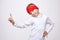 Young man with a headband points up with his index finger. photo session in the Studio on a white background