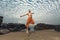 Young man high jumping on beach