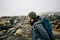 Young man hikes through rough iceland terrain