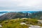 Young man is hiking alone with the beautiful view at the Dalsnuten mountains, Norway