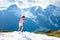 Young man hiking in Alps mountains