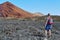 Young man hiking in a volcanic landscape