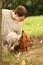 Young man and his dachshund looks on each other