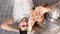 Young man and his girlfriend making heart with her hands indoors, overhead view. Selective focus