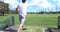 Young man hitting golf balls at a driving range
