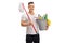 Young man holding a bucket full of cleaning products and a mop
