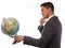 Young man holding a desktop globe