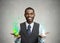 Young man holding green apple and chewing gum in hands