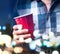 Young man holding red cup in a luxury party.