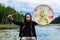 Young man holding sacred drum and fur stick