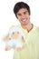 Young man holding sheep plush