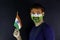 Young man holding tricolour Indian flag and celebrating Independence