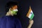 Young man holding tricolour Indian flag and celebrating Independence