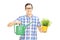 Young man holding watering can and flowerpot