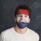 Young man with Holland flag painted on his face