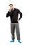 Young man in hood and sweatpants talking on mobile phone