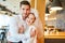 Young man hugs his girlfriend with bridal veil