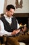 Young man in a hunter\'s cabin reading the bible