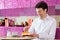 Young man in ice cream parlor