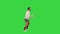 Young man imitating tennis game on a Green Screen, Chroma Key.