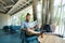 Young man informally studying documents in a coworking space