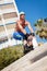 Young man with inline skates in summer outdoor