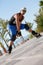 Young man with inline skates in summer outdoor