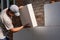 A young man insulates the walls of an apartment building