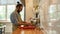 Young man, Italian cook washing tomatoes in the sink in kitchen while preparing vegetables for cooking a meal