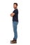 Young Man In Jeans And Blue T-shirt Is Standing With Arms Crossed. Side View