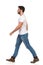 Young Man In Jeans And White T-shirt Is Walking Side View