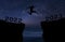 A young man jump between 2022 and 2023 years over night sky with stars and through on the gap of hill  silhouette evening colorful