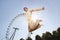 Young man Jumping In Front Of London Eye