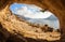 Young man lead climbing in cave