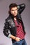 Young man in leather jacket in a fashion pose