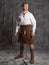 A young man in a leather kilt and a white lace-up blouse. A Scottish knight