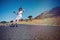 Young man longboarding on a road