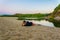 a young man is looking at the estuary of veleka river in Bulgaria during sunset