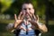 Young man makes hands in shape of love heart