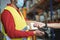 Young man making contactless payment inside warehouse store during coronavirus outbreak - Focus on smart watch