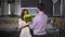 Young man making a surprise for his wife - giving spring  flowers bouquet