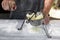 Young man mashing boiled potatoes