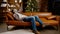 Young man in mask lies on sofa and stares at ceiling, suffering from loneliness and home isolation during Christmas holidays,