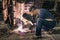 Young man mechanic worker repairing old vintage car body