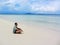 Young man in meditation near the sea