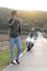 Young man with motorcycle breakdown on the road talking on the phone