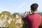 Young Man Mountains Take Photo Of Landscape On Cell Smart Phone Asian Holiday