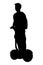 Young man on moving segway silhouette vector