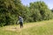 Young man mowing the grass