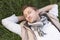 Young man napping alone on grass